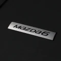 ZNACZEK NA DYWANIKU MAZDA 6.webp